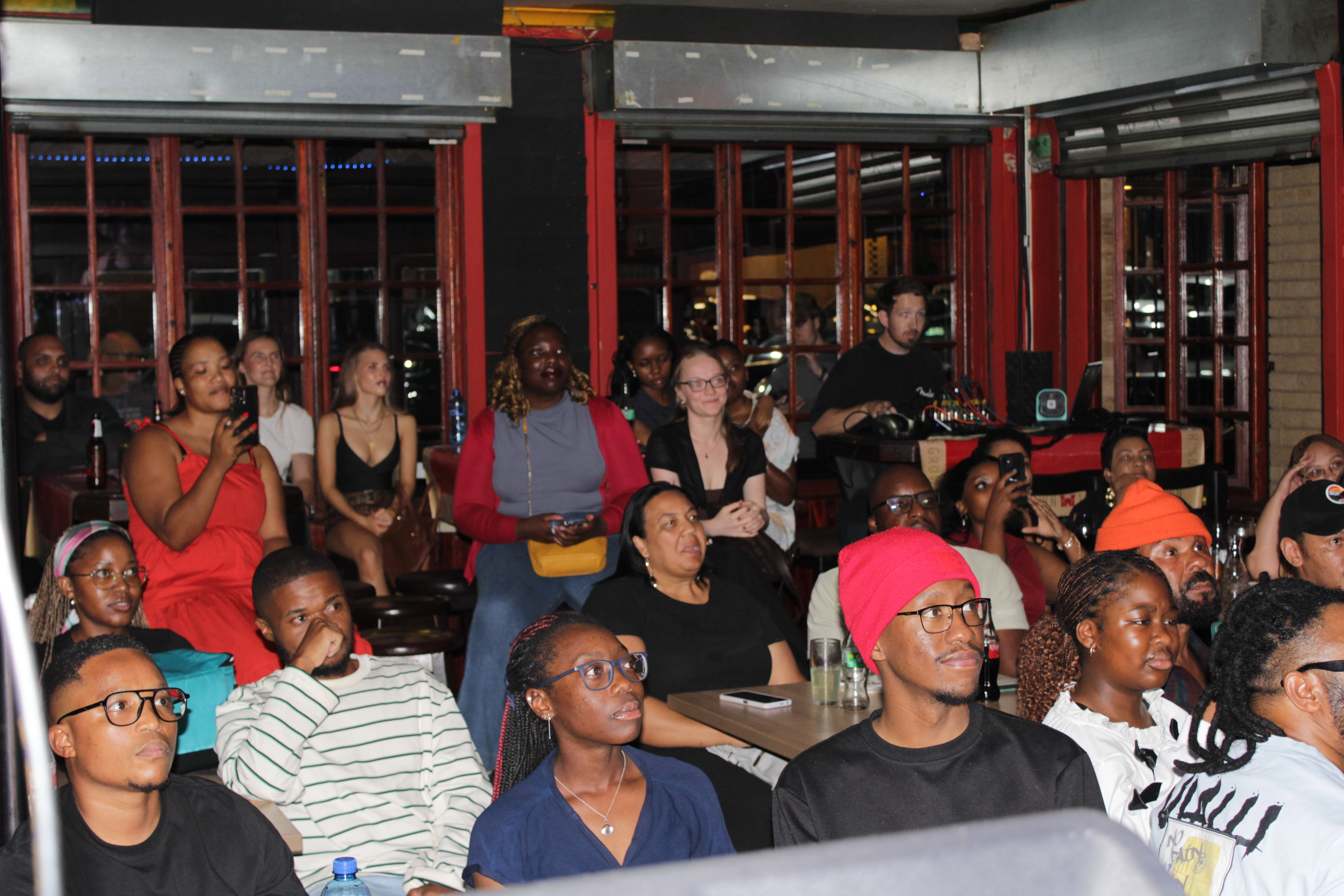 Poets performing live at AJ’s poetry night